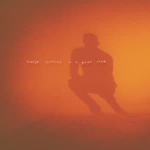 orange curtains in a quiet room - Adam Bokesch